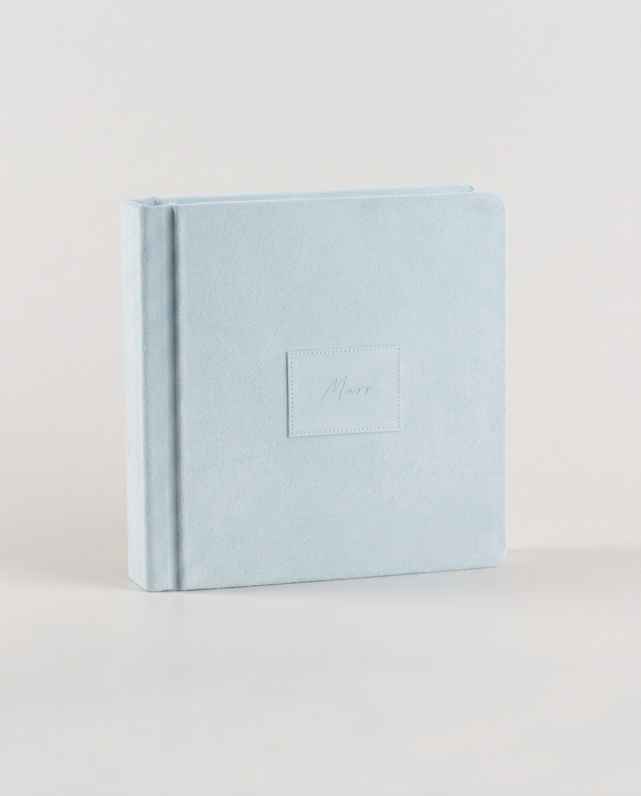 Tramontina suede album standing against a neutral background